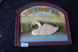 Carved wooden advertising print for The Swan Inn