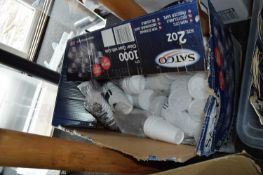 Box containing a large quantity of polystyrene cups and lids