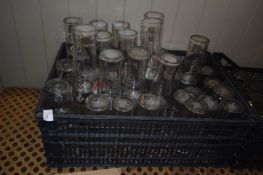 Crate containing mixed branded pint glasses