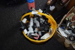 Bucket containing a quantity of plastic keg taps