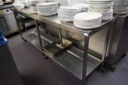 A large stainless steel work station, width 210 cm, height approx 88 cm, depth 60 cm