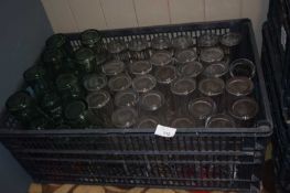 Crate of Coca Cola branded pint and half pint glasses