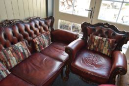 Leather three seater sofa together with an armchair