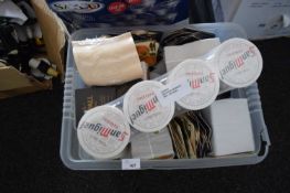 Box containing a large quantity of mixed branded beer mats