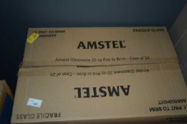 Box containing 12 branded Amstel pint glasses