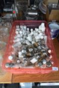 Box containing a large quantity of glass and ceramic salt and pepper shakers