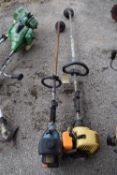 Two petrol strimmers