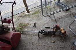 Petrol strimmer together with a petrol brush cutter