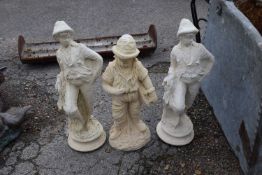 Three composite garden statues, the tallest being 60cm