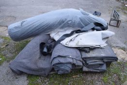 Pallet containing pond liners, ground carpets etc