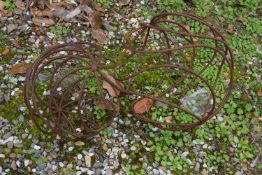 Two decorative spiral metal balls, the tallest being 40cm high