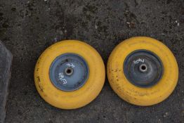 Two wheelbarrow wheels