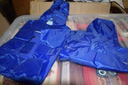 Large quantity of dog rain coats plus a box of 12 boxes of dog wipes