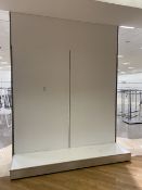 Large partition wall with shelving