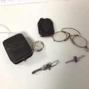 A mixed lot including a National Chrysanthemum Society silver pendant in glass case, a gilt metal