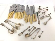 A set of twelve bone handled dinner knives and six bone handled fruit knives together with an