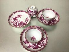 A set of three 19thc Sevres style tea bowls and saucers decorated with handpainted gilt and pink