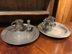 A pair of pewter chargers with reeded rim, no touch marks, together with a group of three 19thc