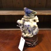 A Chinese carved lapis lazuli vase and cover, the vase boldly in relief with scrolling dragons,