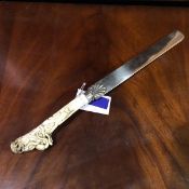 A 19thc Japanese meiji period carved ivory handled silver plated page turner, the handle finely