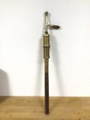 A 19thc brass street lamp lighter torch, marked G12 (73cm)