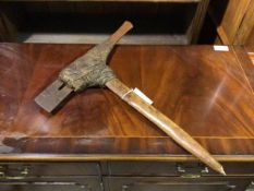 A Mount Hagen axe Papua New Guinea, of characteristic form, with steel blade (54cm x 50cm)