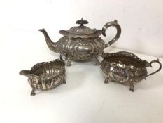 An 1899 London silver teapot with creamer and sugar bowl (770g)
