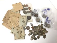 A collection of coins including c.1930s threepences, American Kennedy half dollars, six pence