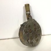 A 19thc Ottoman gun powder flask of circular form, with foliate decoration (15cm x 10cm x 3cm)