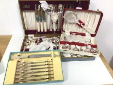 A collection of cutlery, two in original canteens, one marked The Hampshire Canteen, with knives,