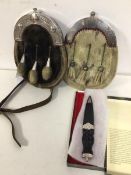 Two sporrans, one marked Hugh Macpherson, St. Catharine's verso (24cm), the other unmarked, and a