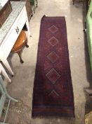 A Meshwani runner, with four diamond medallions within multiple borders (250cm x 66cm)