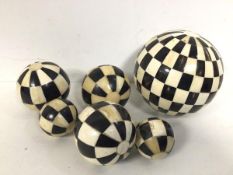 A set of six white bone and ebonised bone bowls (largest: 13cm)
