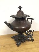 An early 20thc hot water urn on foliate base, lid marked Warranted best London manufacture to