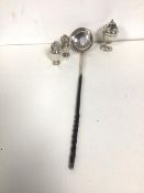 A beleen ladle, the well with a George III coin and initials GBA to base (35cm), a pair of