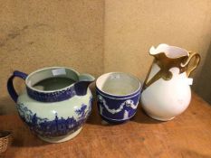 A Wedgwood jasparware cachepot (16cm x 18cm), a 19thc transfer printed ewer and an Edwardian ewer (