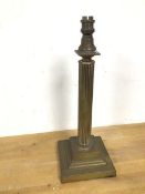 An Edwardian brass table lamp, in the form of a column with stepped base (41cm)