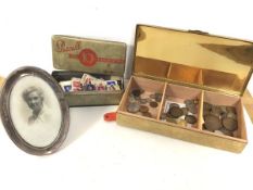 A mixed lot including an Edwardian Birmingham silver photograph frame (16cm x 11cm), a quantity of