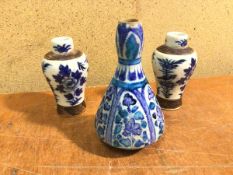 An Iznik vase, with character to base (15cm) and two Chinese baluster shaped vases, both with four