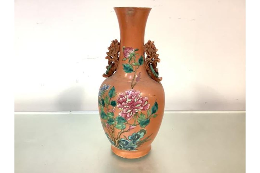 A Chinese famille rose porcelain twin-handled vase, 19th century, of baluster form, with