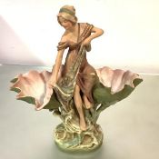 A Royal Dux porcelain figural double comport, modelled as a fisherwoman flanked by two large clam