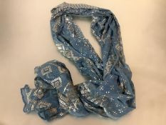 A 1920's Egyptian Assuit shawl, in blue, characteristically decorated with hammered white metal 