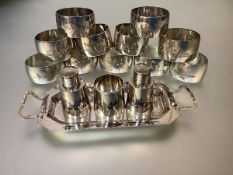 A set of eleven Middle Eastern engraved white metal napkin rings, Iraq, c. 1950-60, most with