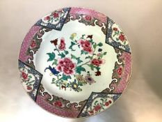 A Chinese famille rose charger, the well painted with sprays of flowers within a border decorated