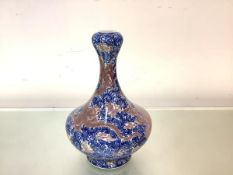 A Chinese blue and white porcelain vase, of shaped baluster from, the waisted neck terminating in