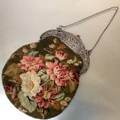 A 19th century Continental silver-mounted needlework lady's handbag, the mount with stamped 800