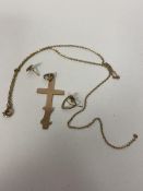 A 9ct gold crucifix measures 4cm along with a cable link chain a/f, heart shaped earring and another