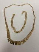 A 9ct gold fancy link bracelet measures 7cm along with 9ct gold necklace with graduated set of
