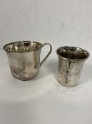 A christening mug with the initial N stamped 835s to base measures 6.5cm high and another mug or cup