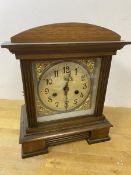 An early to mid 20thc mahogany mantel clock of architectural form, the metal dial with arabic